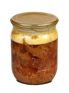 canned meat in glass. Isolated over white background